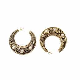 Large golden carved hoop earrings with white pearls